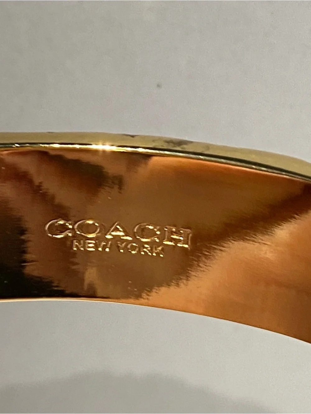 Gold-toned Coach Bangle